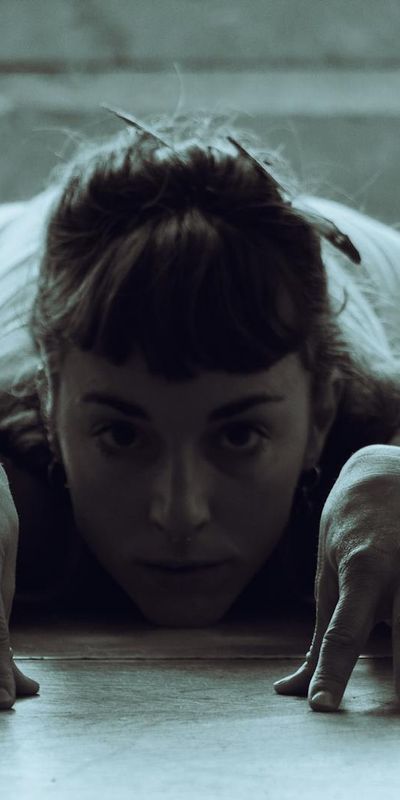 Person in a deep stretching pose, showing flexibility.